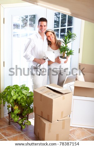 Young happy couple  moving into their new home