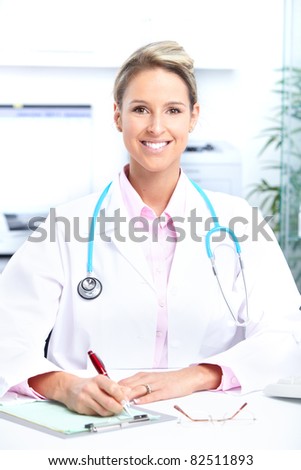 Smiling medical doctor working in the office. Health care.
