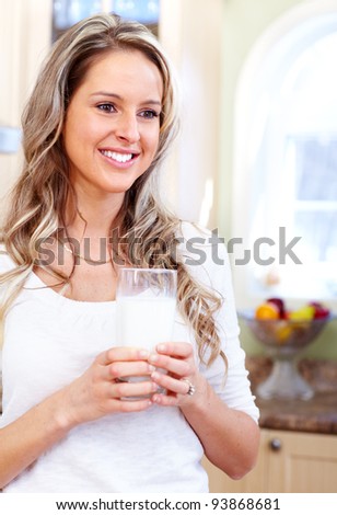 Young beautiful woman drinking milk. Diet.