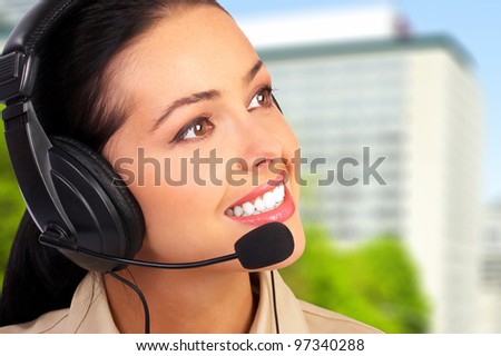 Young business woman with headset. Call center operator.