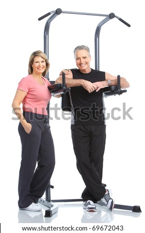 Gym & Fitness. Smiling elderly couple working out. Isolated over white background Foto stock © 