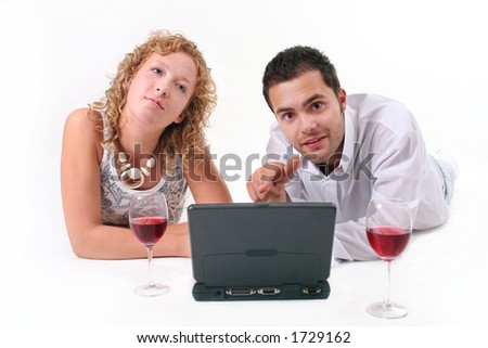 Couple in white >> Browsing the web and drinking red wine