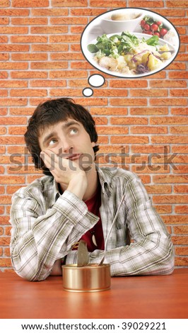 Young man with canned food dreams about real one (in a comic bubble is my other stock photo)