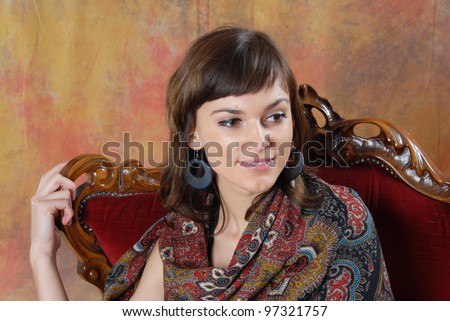 young woman sitting on the chair