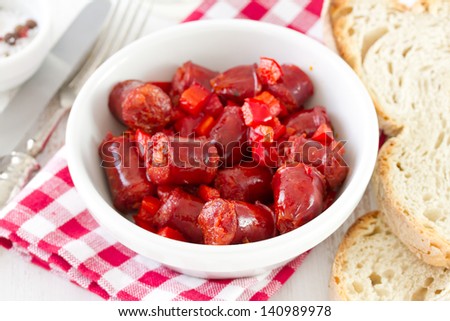 sausages in white bowl with bread