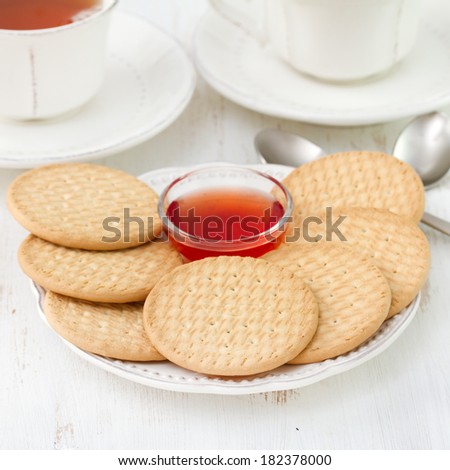 cookies with jam and cups of tea