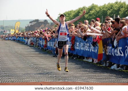 EDINBURGH, SCOTLAND, UK - MAY 23: Phil Hinch finishes as the second man in Edinburgh Marathon , May 23, 2010 in Edinburgh, UK.