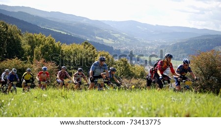 VSETIN, CZECH REPUBLIC - SEPTEMBER 9: Group of bikers climbs the hill above town of Vsetin in Wallachian 50 Mountain Bike Race, September 9, 2006 in Vsetin, Czech republic.