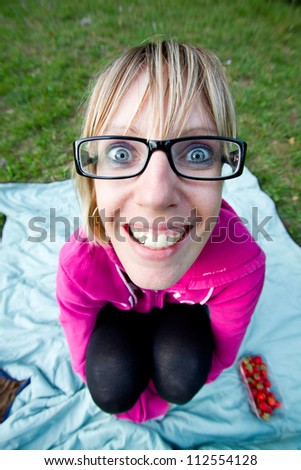 Wide angle shot from above of young woman with glasses