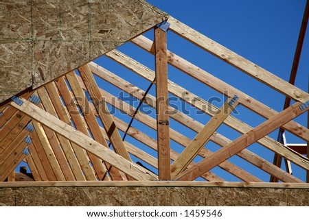 New Housing Construction - Trusses against Bright Blue Sky