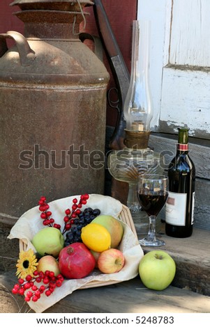 Harvest Basket filled with Fruit, Wine Bottle and Glass