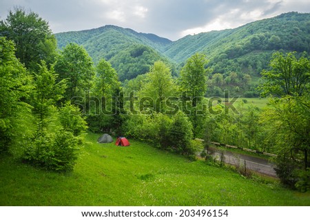 Tourist camp in the mountains. Sunny spring morning