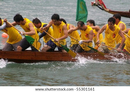 TUEN MUN, HONG KONG -  JUNE 16: Participants paddle their boat during a dragon boat race on June 16, 2010 in Tuen Mun, Hong Kong