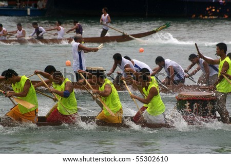 TUEN MUN, HONG KONG -  JUNE 16: Participants paddle their boats during a dragon boat race on June 16, 2010 in Tuen Mun, Hong Kong