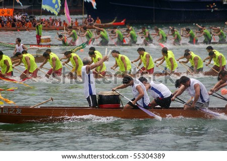TUEN MUN, HONG KONG -  JUNE 16: Participants paddle their boats during a dragon boat race on June 16, 2010 in Tuen Mun, Hong Kong