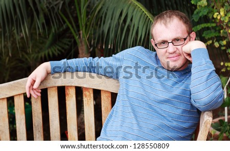 handsome 35 years old man with glasses outdoors