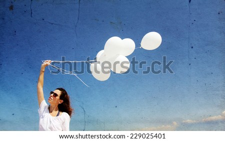 woman with white balloons. Photo in old image style
