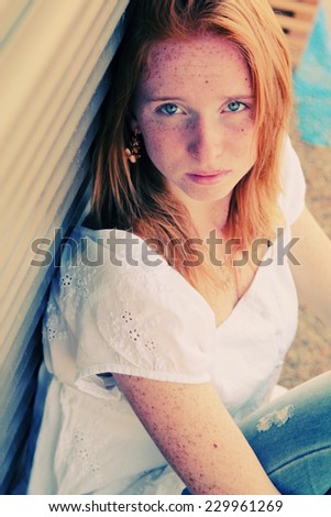 Closeup portrait of beautiful young redhead girl