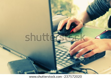 woman with laptop sitting in the cafe