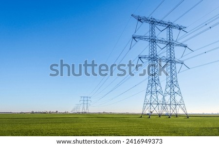 Similar – Image, Stock Photo High voltage pylons in front of orange-red evening sky, low horizon, crossing lines, pylons partly cut off