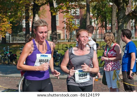 BREDA, NETHERLANDS – OCT. 2: Singelloop (Canal Run), Two female runners during the last mile of the yearly Singelloop in the Dutch city of Breda in the Netherlands on October 2, 2011.