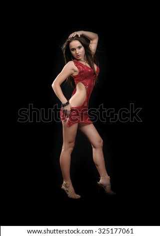 Beautiful sexual girl model in erotic cloth pose on black background
