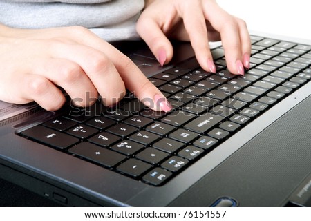 Image of female hands on keyboard of laptop during corporate work