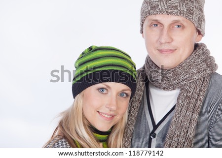 Young happy attractive couple in winter clothing