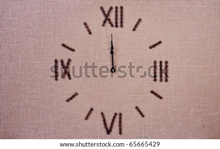 Clock made of coffee beans. Twelve o\'clock