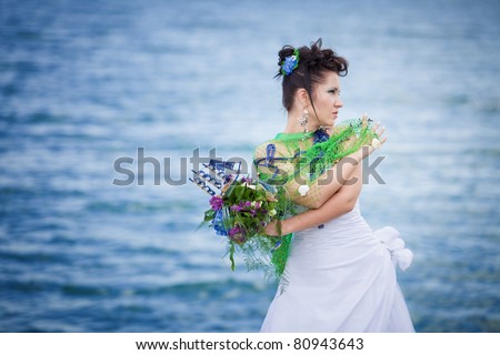 Beautiful bride with green grid over her dress