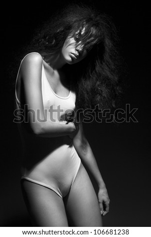 Black and white art photo. Elegant lady with hairstyle
