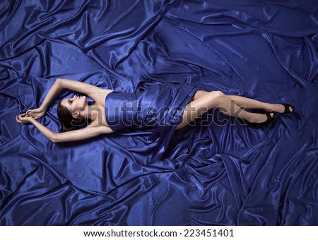 Young beauty woman in blue dress.