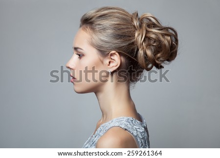 Beautiful Blond Woman. Hairstyle and Make-up.