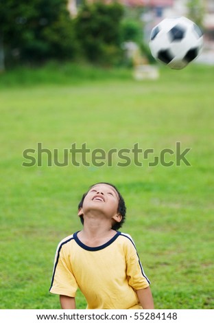 A local boy playing football
