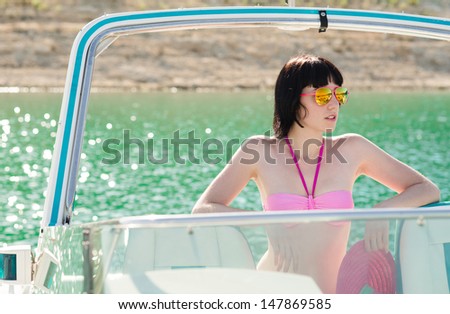 Sexy girl in bikini on a yacht