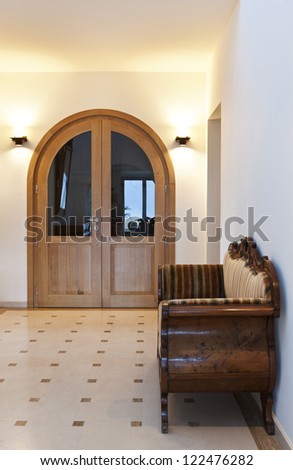 beautiful apartment, interior, corridor with antique sofa