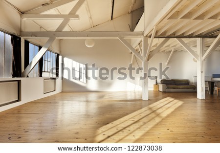 wide open space, beams and wooden floor