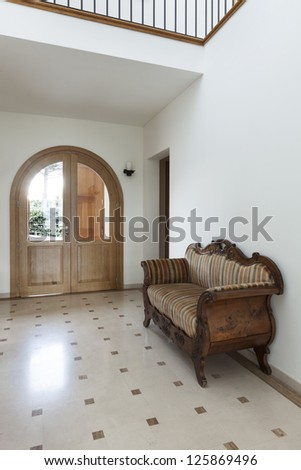 Interior, apartment, corridor with antique sofa