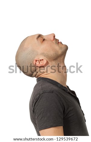 man with shaved head in profile position