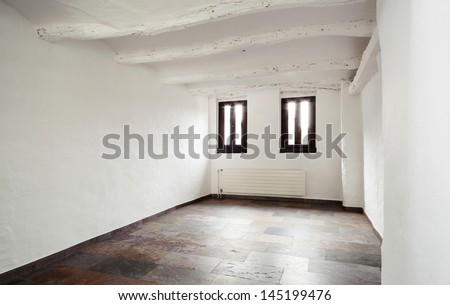 interior rustic house, room with two small windows