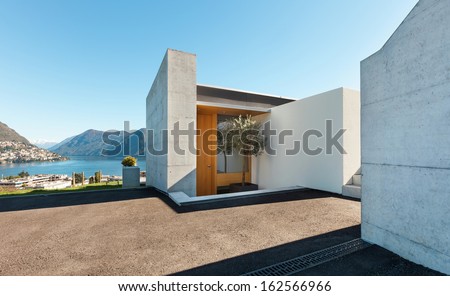 beautiful modern house in cement, outdoor, entry view