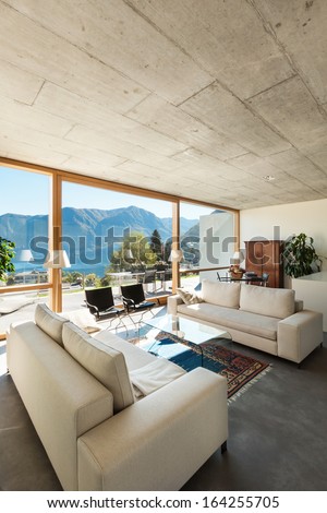 beautiful modern house in cement, interiors, view from the living room