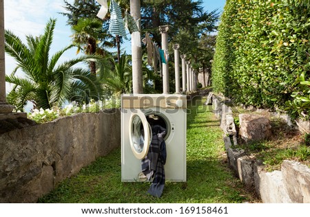 old washing machine in a garden, outdoors