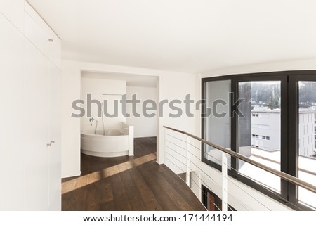 beautiful interior of a new apartment, view bathtub from corridor