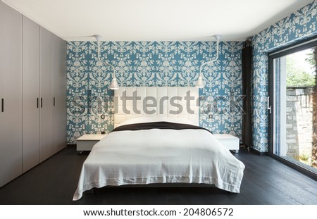 interior of a modern villa, beautiful bedroom, double bed