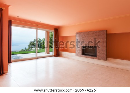 Interior, luxury villa, wide living room with fireplace