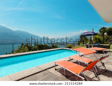 beautiful terrace with swimming pool in a villa on the lake