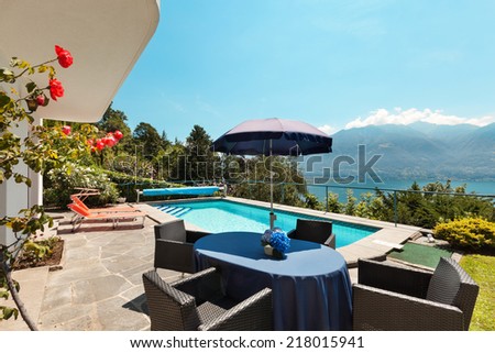 Nice terrace with swimming pool in a house on the lake
