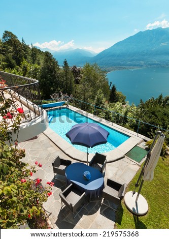 Nice terrace with swimming pool in a house on the lake