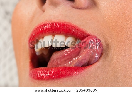 Sensual open mouth, tongue touches the teeth